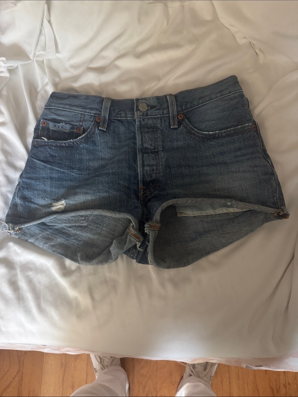 Levi's Distressed Denim Cutoff Shorts in Blue Wash